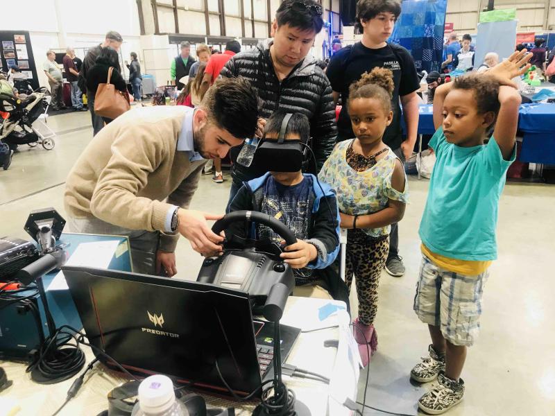 Middle school students experiencing VR technology